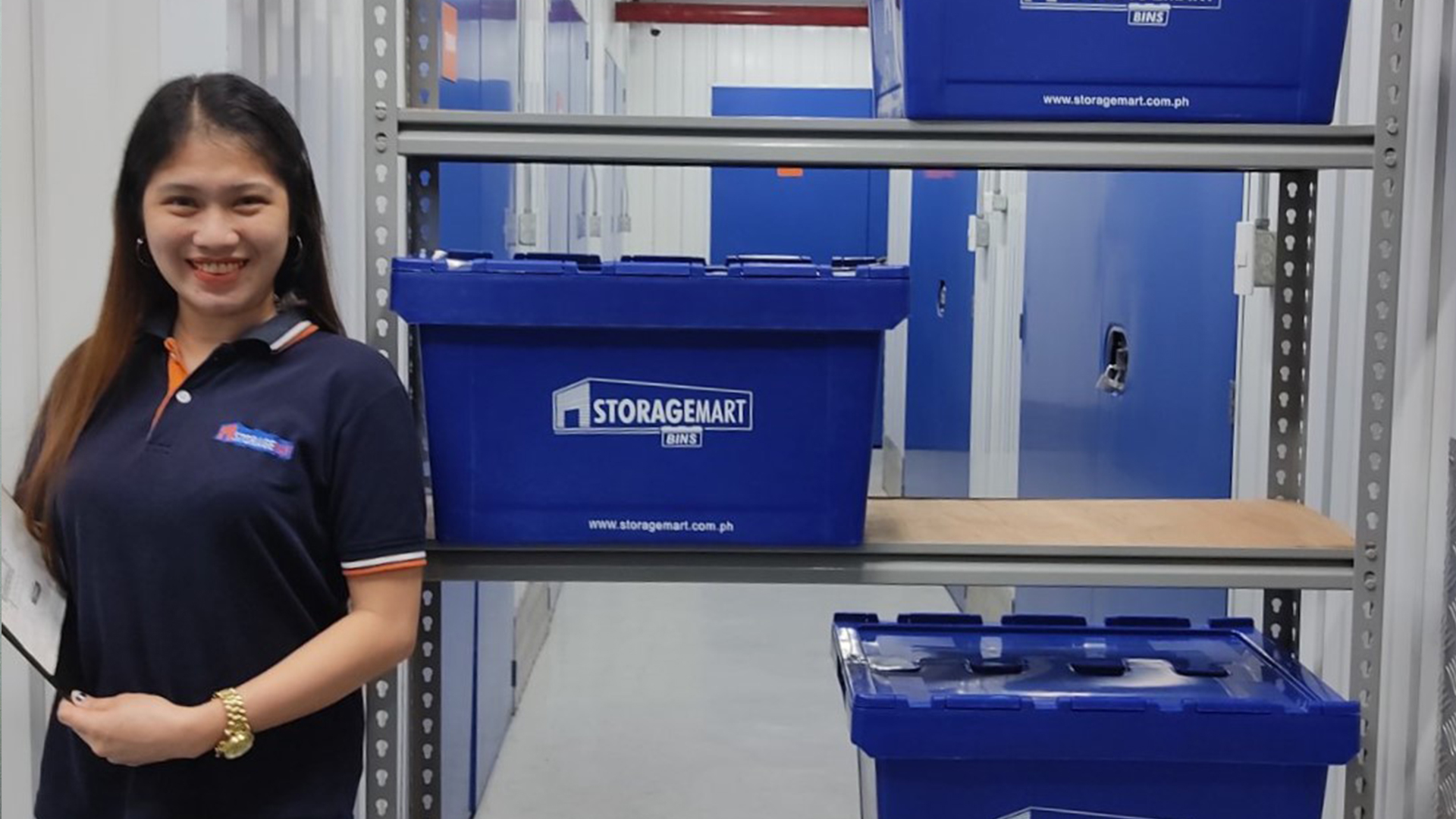 A woman behind storagemart box in storage facilities | Storagemart